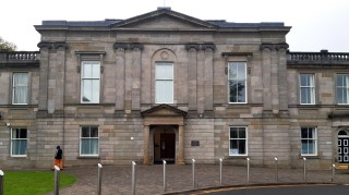 The charges at  Dumbarton sheriff court relate to nine students and are alleged to have taken place between September 2004 and July 2019
