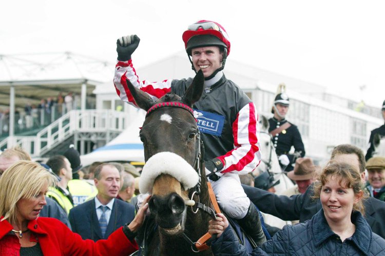 Grand National-winning jockey in intensive care after fall