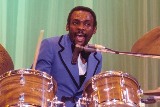 Brown playing live in 1974. Despite growing up in poverty he always had music
